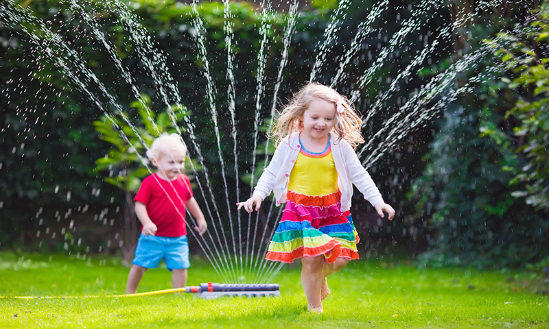 Arching sprinklers are fun to play in, but they lose lots of water to evaporation.